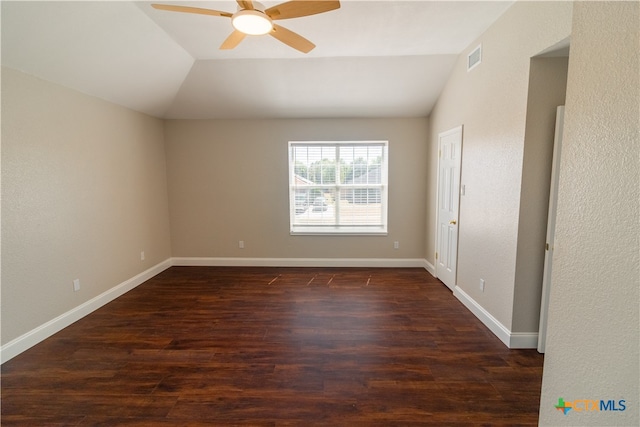 unfurnished room with ceiling fan, dark hardwood / wood-style floors, and lofted ceiling