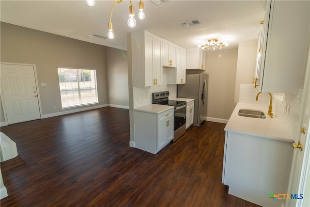 kitchen featuring white cabinets, stainless steel appliances, sink, and dark hardwood / wood-style flooring