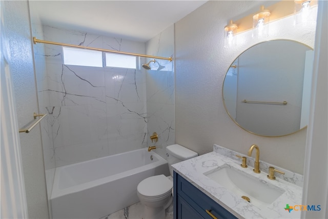 full bathroom featuring vanity, toilet, and tiled shower / bath