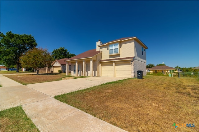 view of front facade featuring a garage and a front yard