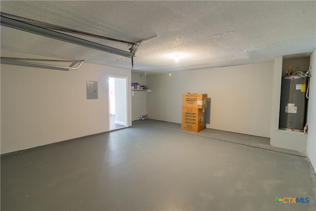 garage featuring electric panel and electric water heater