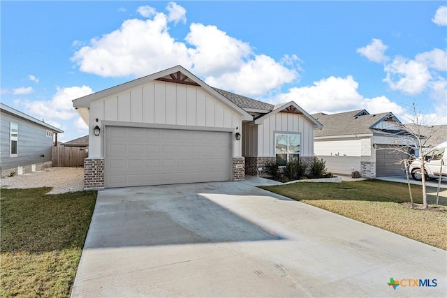 view of front of house featuring a front yard and a garage