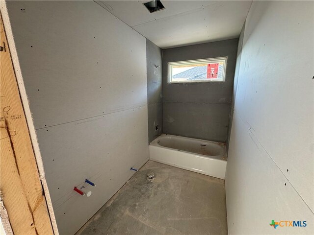 2528 Cowgirl Trl, Belton, TX 76513 - bathroom with a tub to relax in and concrete flooring