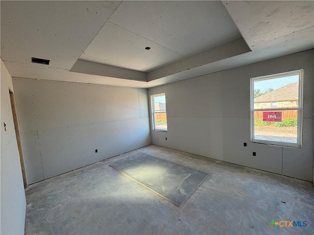 2528 Cowgirl Trl, Belton, TX 76513 - spare room featuring a raised ceiling and concrete floors