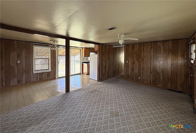 201 Dewald St, Copperas Cove, TX 76522 - spare room with ceiling fan and wood walls