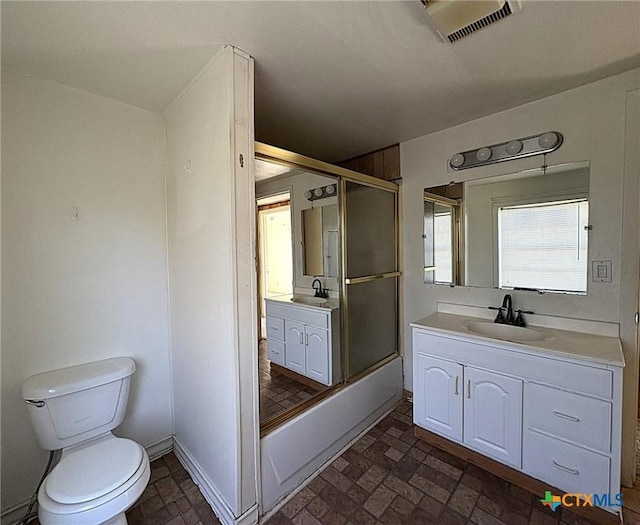 201 Dewald St, Copperas Cove, TX 76522 - full bath featuring toilet, vanity, baseboards, and brick patterned flooring