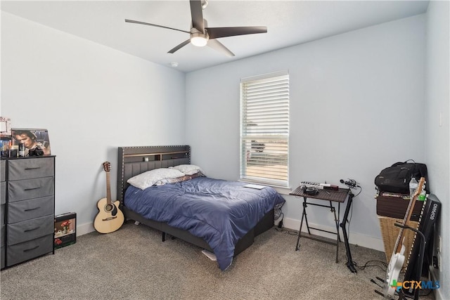 carpeted bedroom featuring multiple windows and ceiling fan