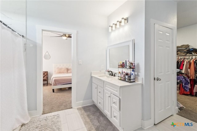 bathroom featuring tile patterned floors, ceiling fan, and vanity