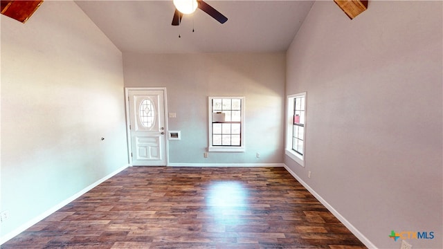 unfurnished room featuring high vaulted ceiling, dark hardwood / wood-style floors, and ceiling fan