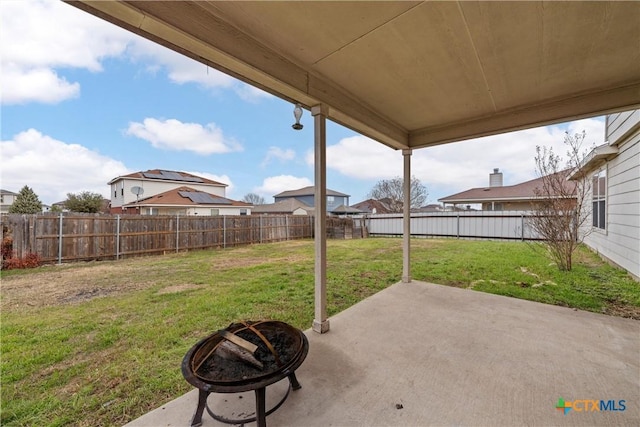 view of patio / terrace with a fire pit