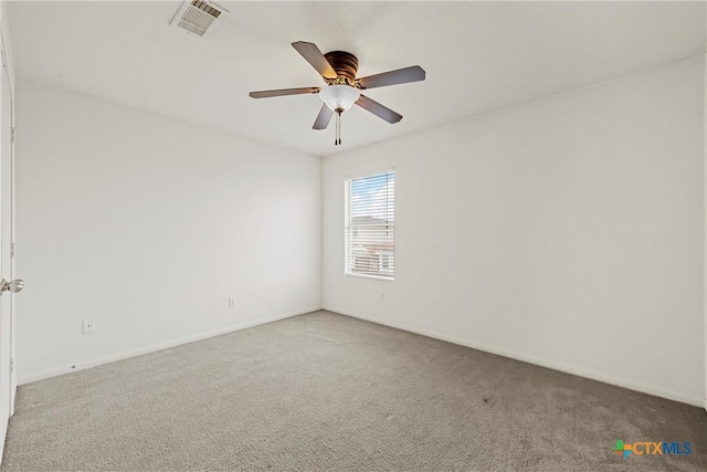 empty room featuring ceiling fan and carpet flooring