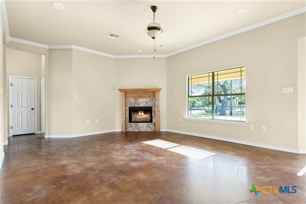 unfurnished living room featuring ceiling fan, a high end fireplace, and crown molding