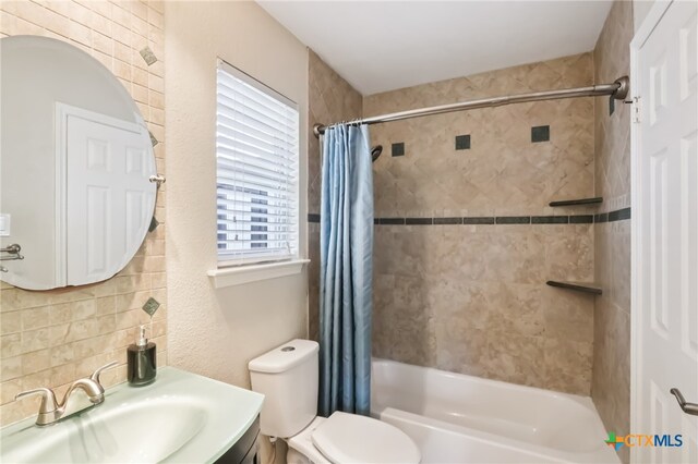 11611 Quarter Horse Trl, Austin, TX 78750 - bathroom with shower / bathtub combination with curtain, vanity, and decorative backsplash