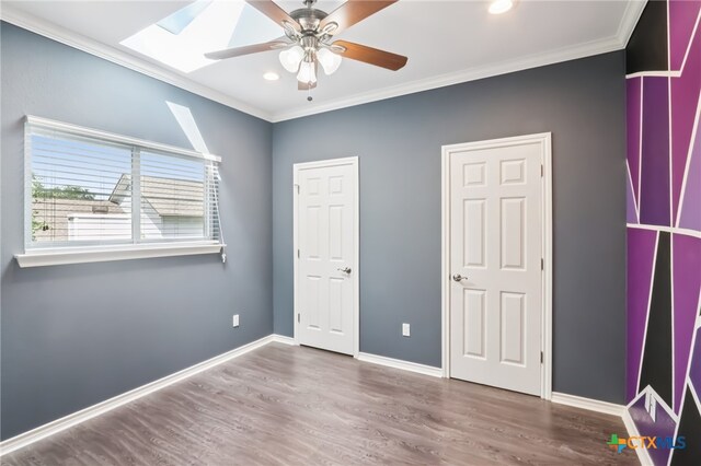11611 Quarter Horse Trl, Austin, TX 78750 - unfurnished bedroom with ornamental molding, wood finished floors, recessed lighting, and ceiling fan