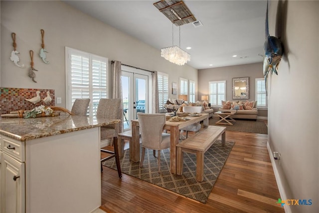 261 E Burgundy Bay Prt, Oconnor, TX 77982 - dining space featuring visible vents, baseboards, wood finished floors, and recessed lighting