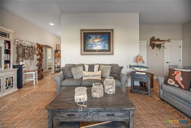 261 E Burgundy Bay Prt, Oconnor, TX 77982 - living area featuring arched walkways and recessed lighting