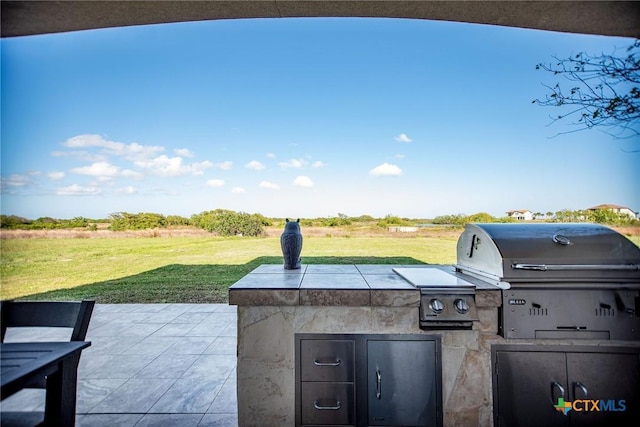 261 E Burgundy Bay Prt, Oconnor, TX 77982 - view of patio / terrace featuring exterior kitchen and area for grilling