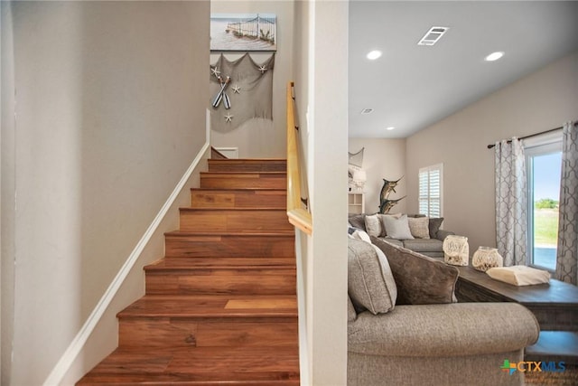 261 E Burgundy Bay Prt, Oconnor, TX 77982 - stairway featuring recessed lighting, visible vents, and wood finished floors