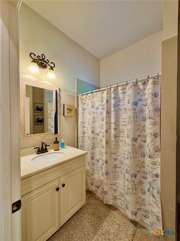 261 E Burgundy Bay Prt, Oconnor, TX 77982 - full bathroom featuring a shower with curtain and vanity
