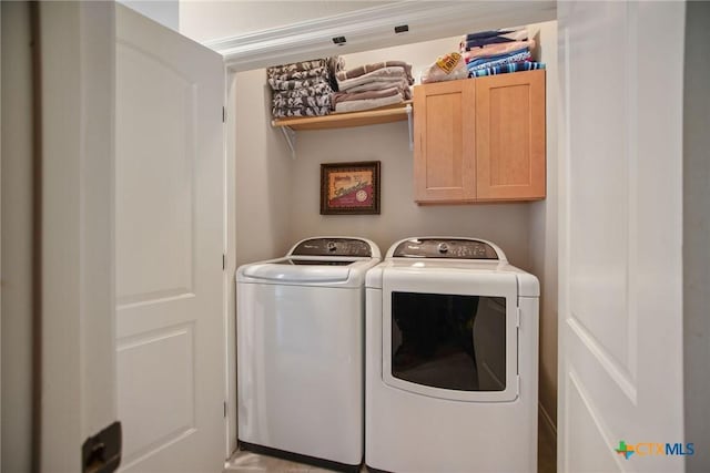 261 E Burgundy Bay Prt, Oconnor, TX 77982 - laundry area with washer and dryer and cabinet space