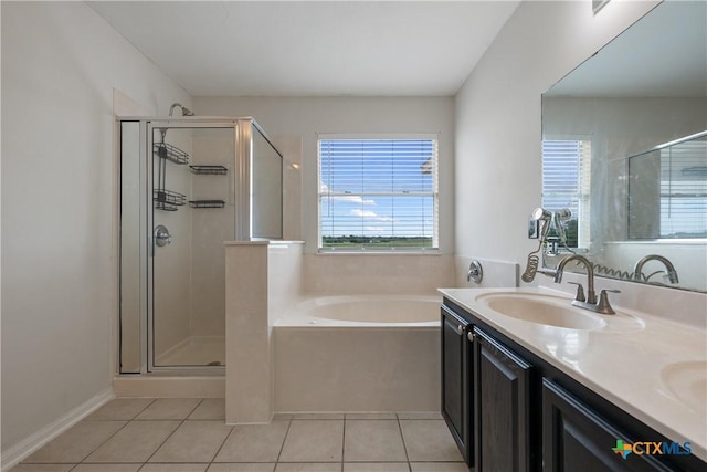 6008 Horne Dr, Killeen, TX 76542 - full bath with a sink, double vanity, a stall shower, a garden tub, and tile patterned flooring