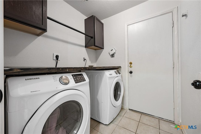 6008 Horne Dr, Killeen, TX 76542 - laundry room featuring light tile patterned floors, separate washer and dryer, and cabinet space