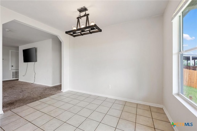 6008 Horne Dr, Killeen, TX 76542 - unfurnished dining area with a chandelier, light tile patterned flooring, visible vents, light carpet, and baseboards