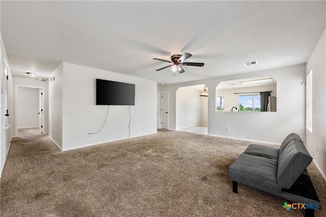 6008 Horne Dr, Killeen, TX 76542 - unfurnished living room with a ceiling fan, visible vents, carpet floors, and baseboards