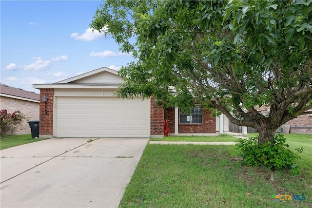 6008 Horne Dr, Killeen, TX 76542 - view of front of home with brick siding, a front lawn, driveway, and an attached garage