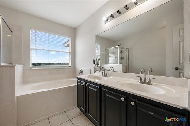 6008 Horne Dr, Killeen, TX 76542 - bathroom featuring a bath, tile patterned flooring, a sink, and a shower stall