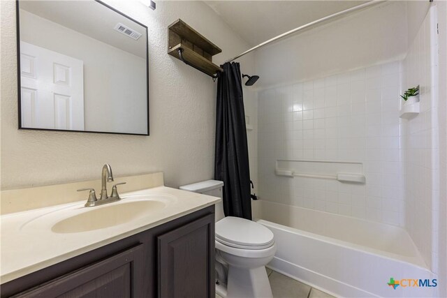 6008 Horne Dr, Killeen, TX 76542 - bathroom with visible vents, shower / bath combo with shower curtain, toilet, vanity, and tile patterned flooring