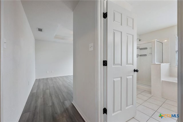6008 Horne Dr, Killeen, TX 76542 - hall with visible vents, tile patterned flooring, and baseboards