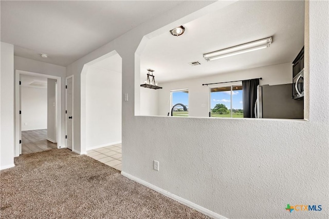 6008 Horne Dr, Killeen, TX 76542 - carpeted empty room featuring visible vents, tile patterned floors, and baseboards