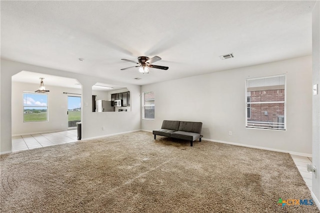 6008 Horne Dr, Killeen, TX 76542 - unfurnished room with baseboards, light tile patterned floors, ceiling fan, and light colored carpet