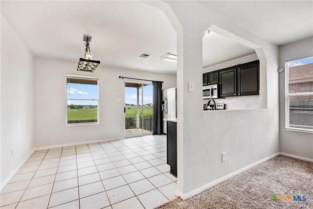 6008 Horne Dr, Killeen, TX 76542 - unfurnished dining area featuring visible vents and baseboards