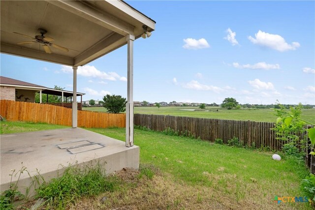 6008 Horne Dr, Killeen, TX 76542 - view of yard with ceiling fan, a fenced backyard, and a patio area