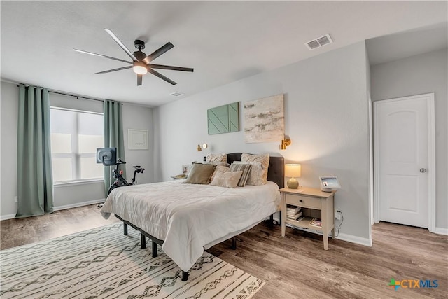 5010 Fallen Tree Dr, Temple, TX 76502 - bedroom with wood finished floors, baseboards, and ceiling fan