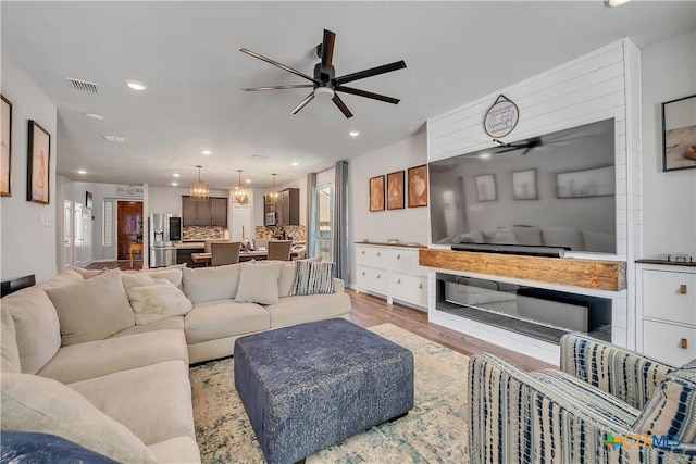 5010 Fallen Tree Dr, Temple, TX 76502 - living area with ceiling fan, recessed lighting, and wood finished floors
