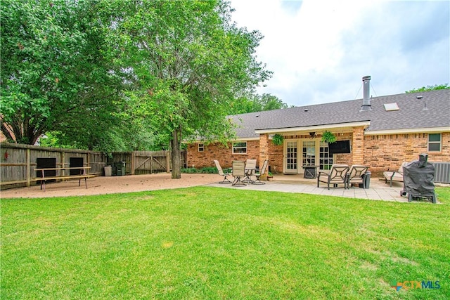 1600 Stagecoach Cir, Salado, TX 76571 - back of property with a patio area, brick siding, a shingled roof, and ceiling fan