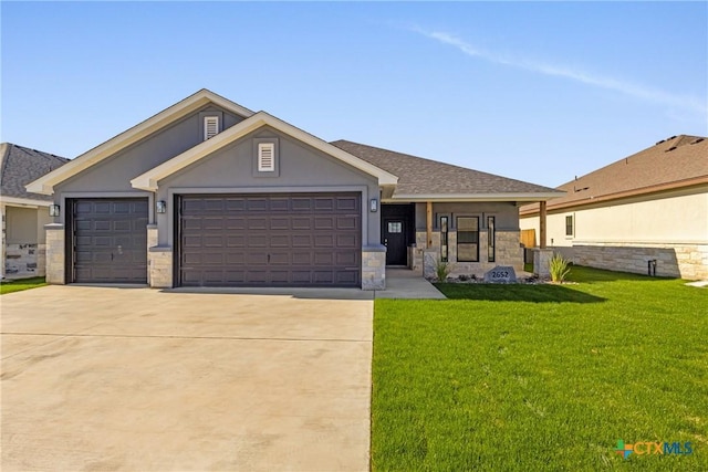 view of front of house with a front lawn and a garage