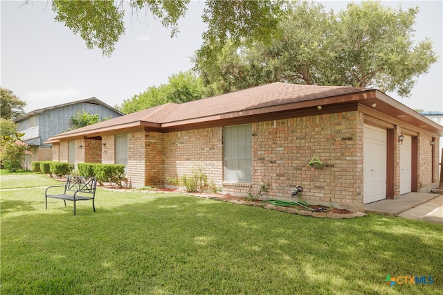 view of front of home with a garage and a front yard