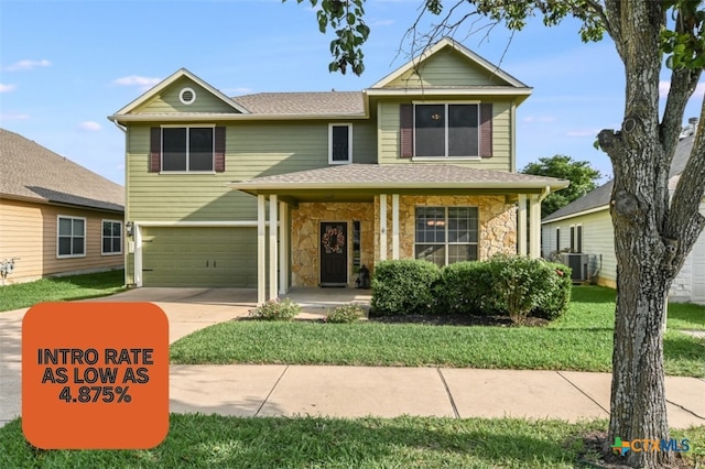 1122 Boxwood Loop, Georgetown, TX 78628 - traditional-style home with an attached garage, stone siding, driveway, and roof with shingles
