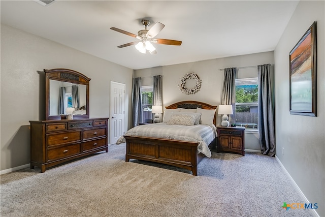 bedroom featuring carpet floors, baseboards, and ceiling fan