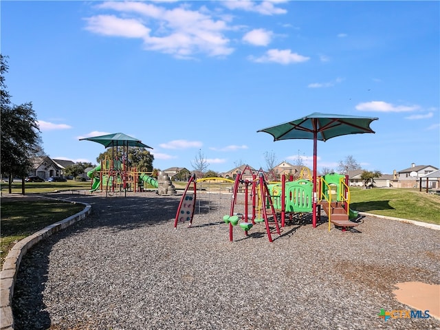communal playground with a lawn