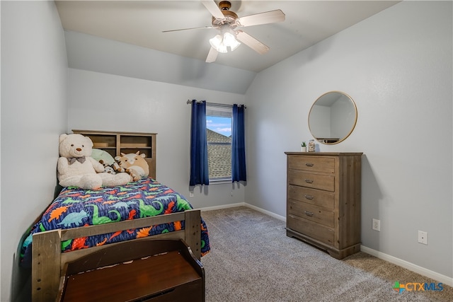 carpeted bedroom featuring baseboards, a ceiling fan, and lofted ceiling