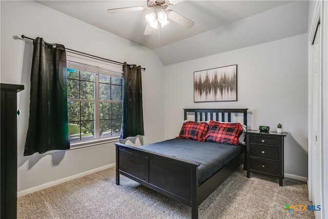 1122 Boxwood Loop, Georgetown, TX 78628 - bedroom with carpet, baseboards, vaulted ceiling, and ceiling fan