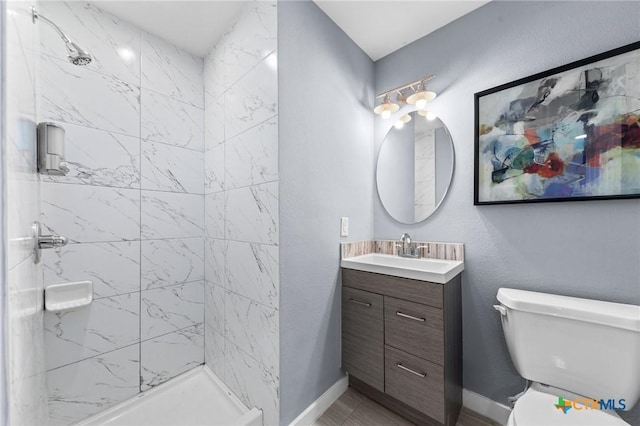 313 E Texas Ave, Killeen, TX 76541 - bathroom with vanity, a stall shower, toilet, and baseboards