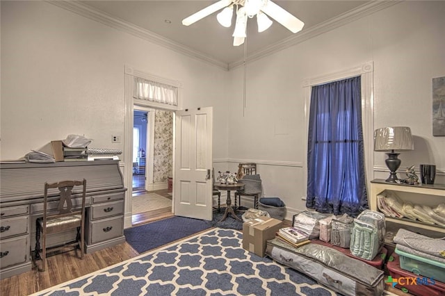 bedroom featuring crown molding, ceiling fan, and dark hardwood / wood-style flooring