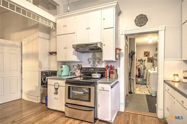 kitchen featuring white cabinets, electric range, and light hardwood / wood-style flooring