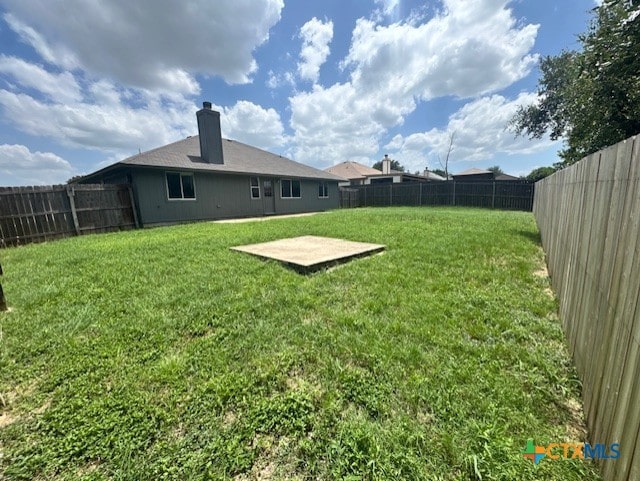 5105 Parkwood Dr, Killeen, TX 76542 - fenced backyard with a patio area